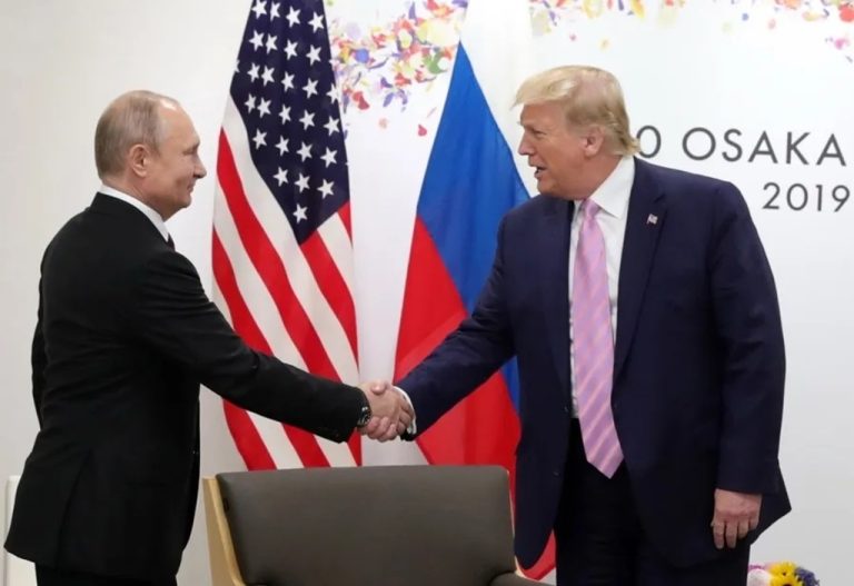 Russian President Vladimir Putin (left) greets his US counterpart Donald Trump.