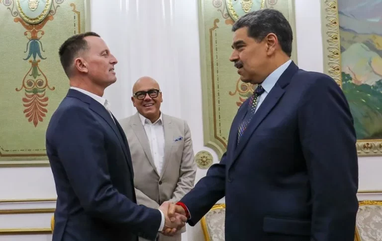 Venezuelan dictator Nicolas Maduro (R) greets U.S. official Richard Grenell, in Caracas.
